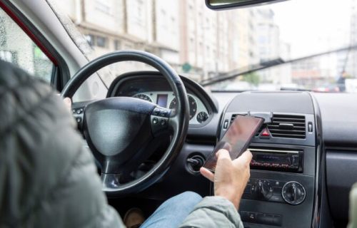 A,Male,Driver,In,A,Green,Jacket,Is,Dangerously,Using